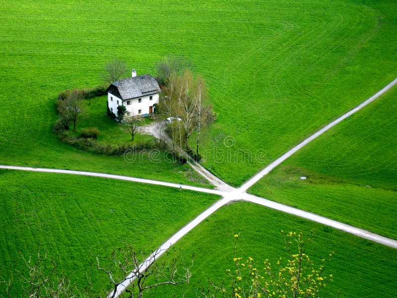 Be single rural house on the green field with cross roads. Be single rural house on the green field with cross roads