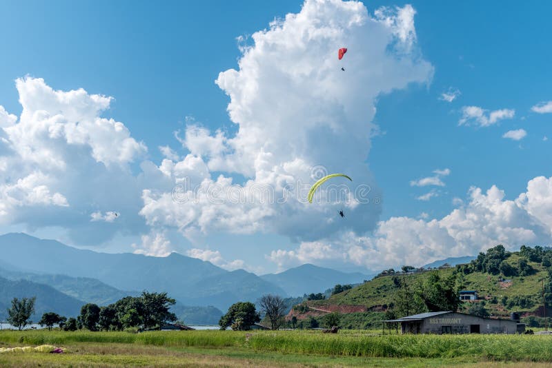 Landing with Parachute after Paragliding in Nepal Stock Image Image