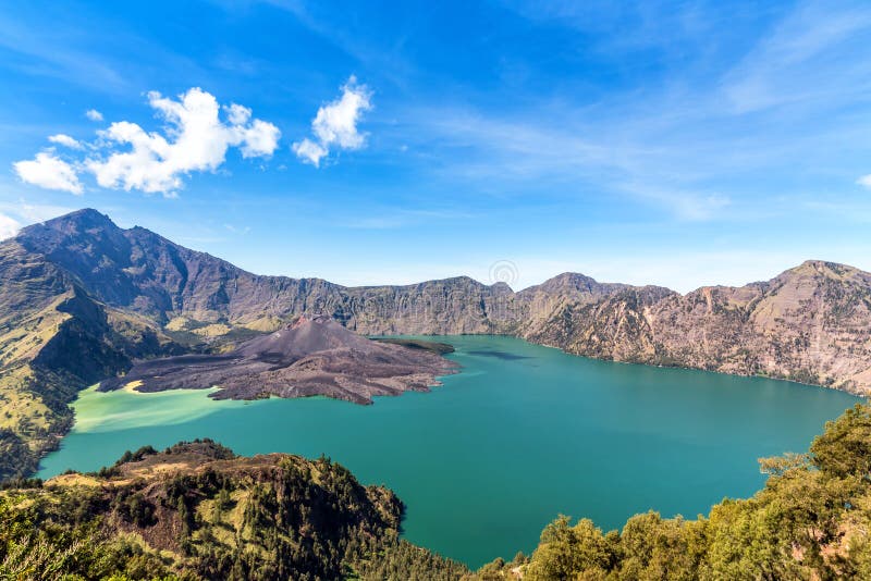 Landscape of active volcano Baru Jari, Lake Segara Anak and summit of Rinjani mountain. Lombok island, Indonesia stock image Landscape of active volcano Baru Jari, Lake Segara Anak and summit of Rinjani mountain. Lombok island, Indonesia stock image