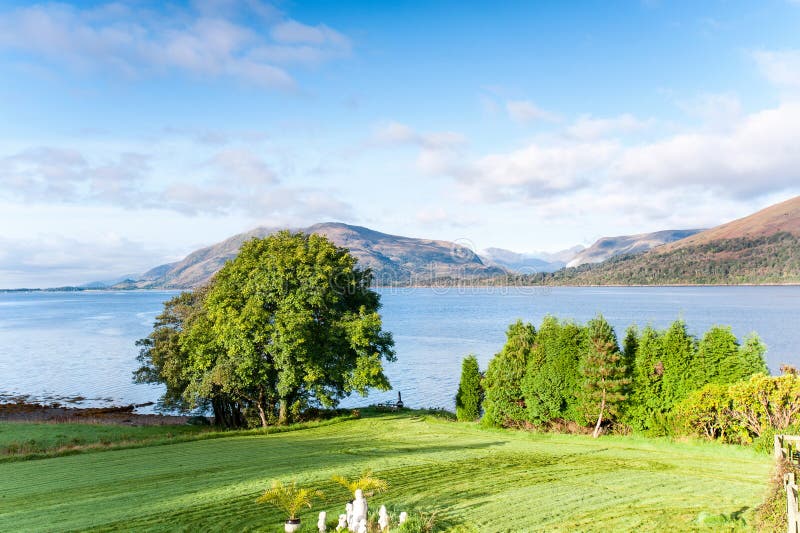 Landscape with beautiful scottish wild mountains lake and green