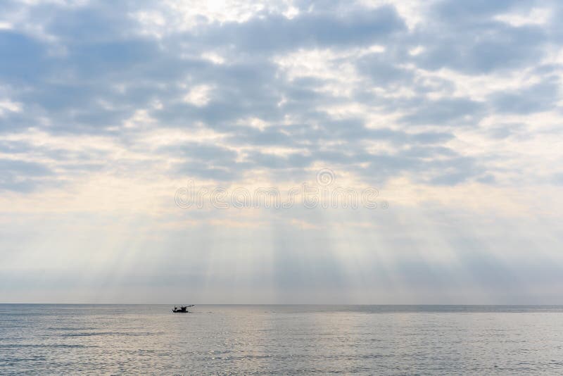 Landscape Of Bright Sea And Clouds Illuminated By The Golden Rays Of