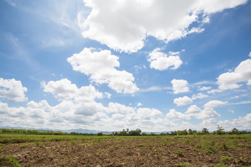 Landscape of could in blue sky with mountain and fields view in the afternoon sun light