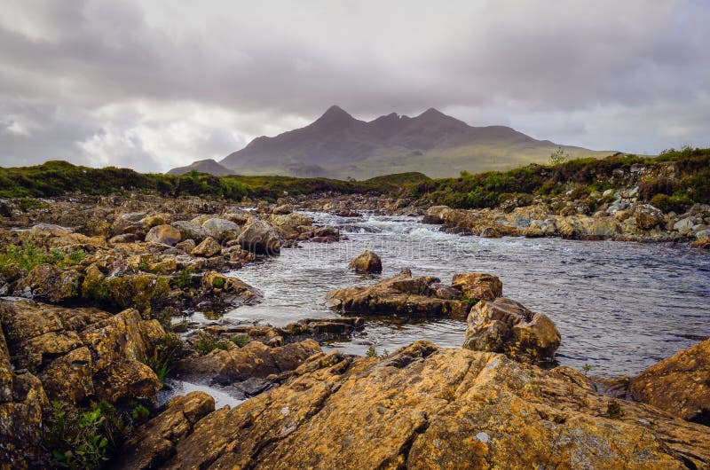 Landscape of Cuillin hills and river, Scottish highlands