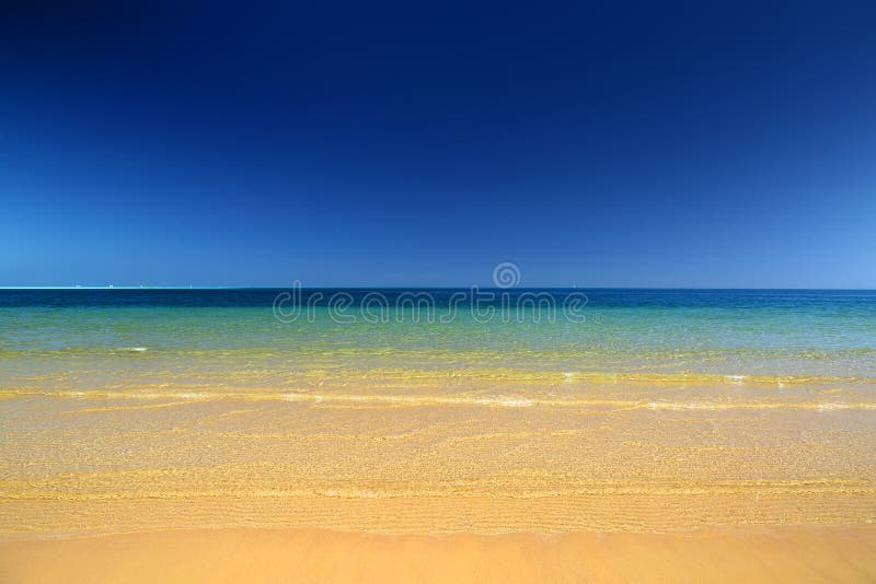 Landscape with gold sand beach and sea