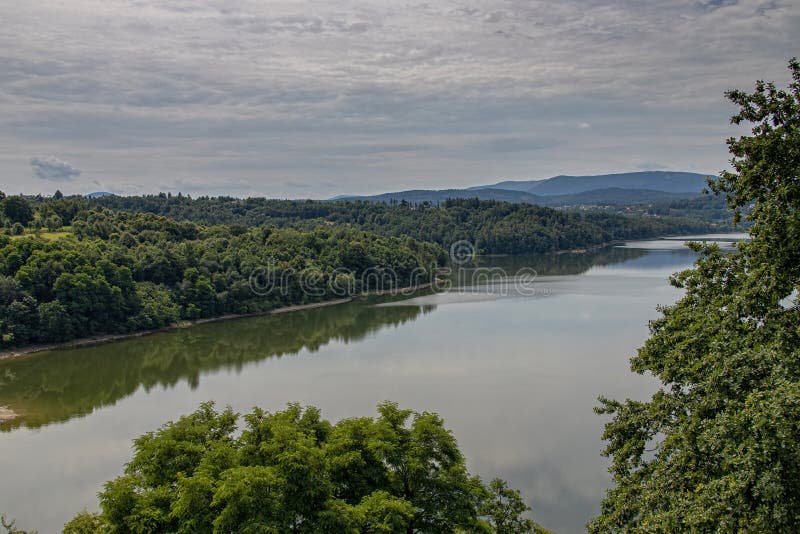 Landscape of the lagoon at the dam in Dobczyce in Poland on a warm summer cloudy day