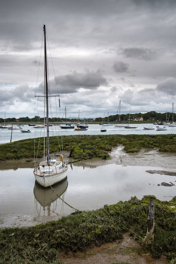 Landscape of moody evening sky over low tide marine