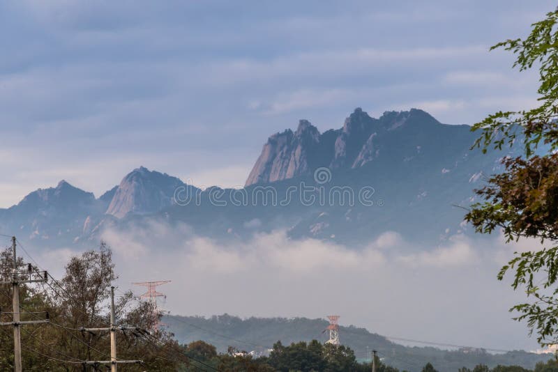 Mountain Peak Surrounded By Fog And Morning Mist Stock Photo Image Of