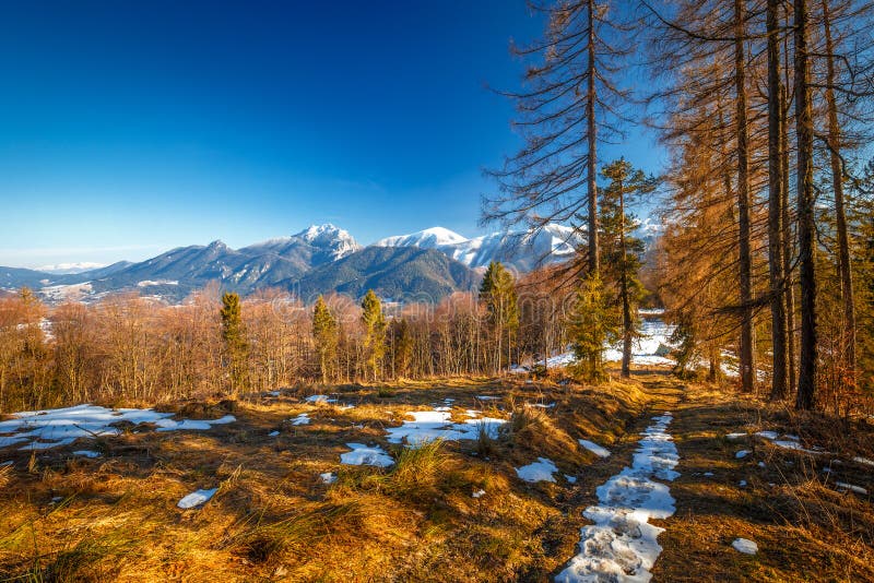 Landscape with mountains in the background at the end of winter