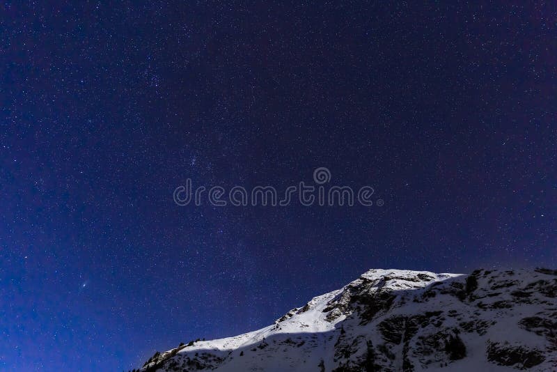 Landscape with mountains and blue sky in winter night in Romania