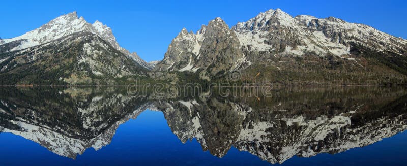 Grand Teton National Park, Rocky Mountains Landscape Panorama, Wyoming, United States - Teton Range Reflected in Jenny Lake royalty free stock photos Grand Teton National Park, Rocky Mountains Landscape Panorama, Wyoming, United States - Teton Range Reflected in Jenny Lake royalty free stock photos