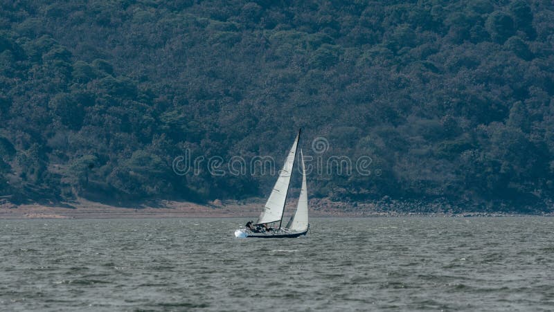 Landscape photography. Bay with sailboats on the water, in the rear you can see the mountains. In Valle de Bravo, Mexico.  2