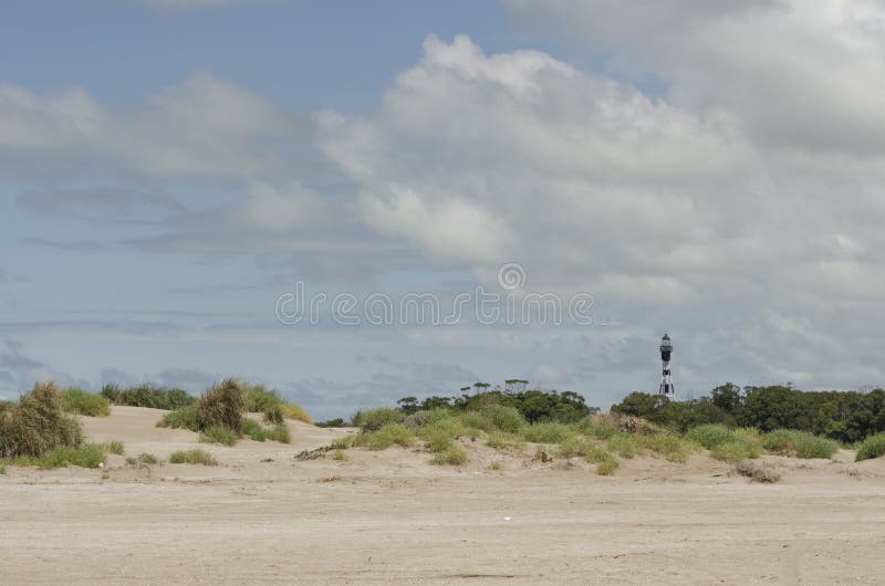 Landscape of Punta Rasa, dunes, coastal vegetation and San Antonio Lighthouse