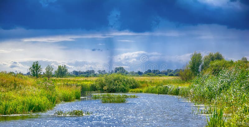 Landscape with river, clouds and rain in the sky. stock photography Landscape with river, clouds and rain in the sky. stock photography