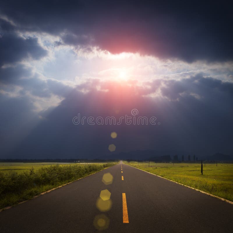 Landscape road, clouds and god ray