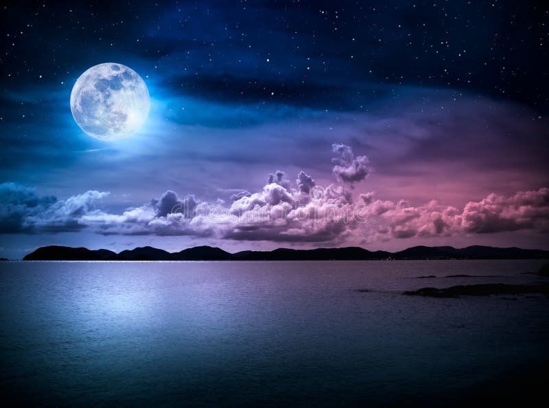 Beautiful landscape view of the sea with many stars . Attractive dark sky with cloud and full moon on seascape to night. Serenity nature background. High contrast. The moon taken with my own camera. Beautiful landscape view of the sea with many stars . Attractive dark sky with cloud and full moon on seascape to night. Serenity nature background. High contrast. The moon taken with my own camera