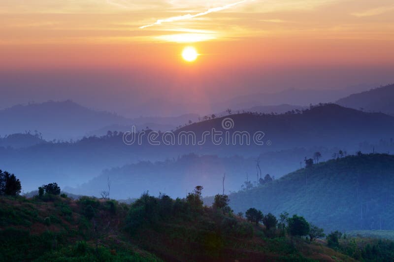 Landscape of sunrise over mountains in Kanchanabur