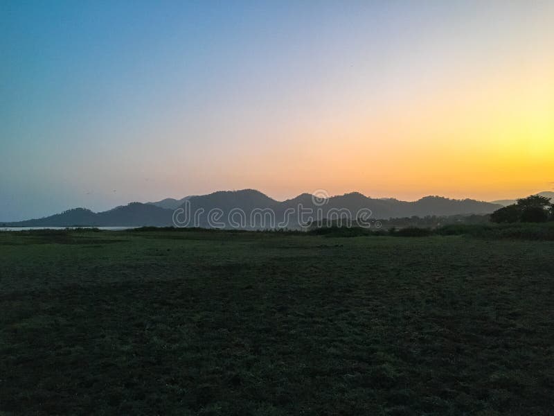 Landscape View at Sunset. Mountains in the Background Stock Photo - Image  of landscape, horizon: 173376330