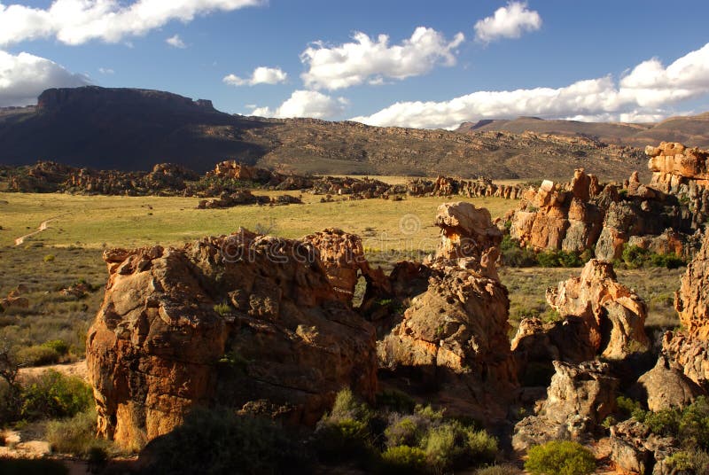 Landscape - yellow -red rocks against mountains o