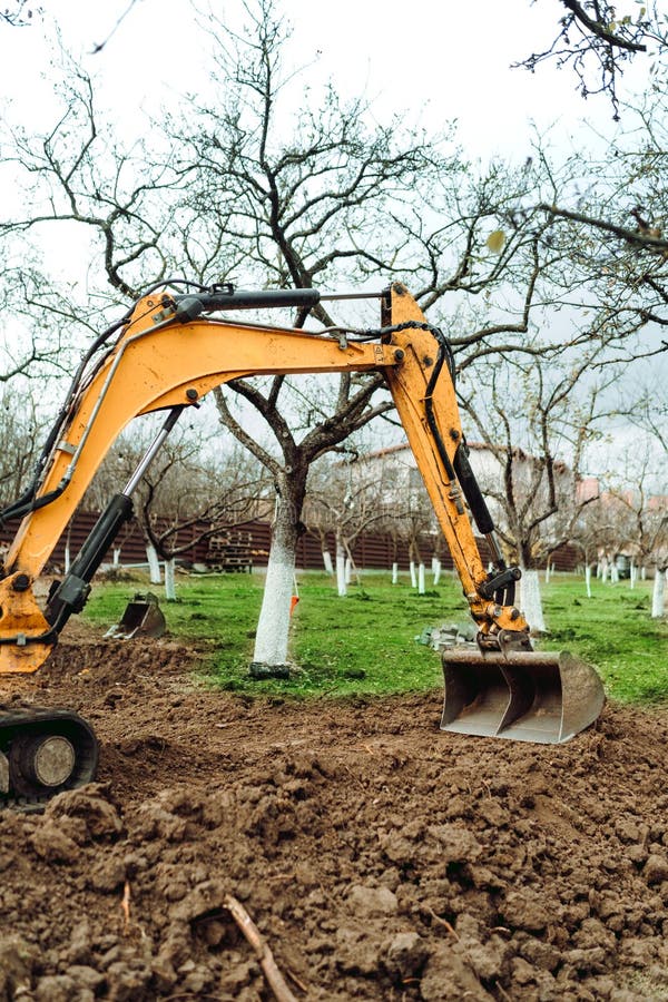 Landscaping Works at Home Construction Site Using Excavator and Mini