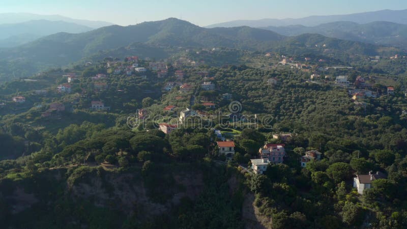 Aerial view of landscape in Garbasso, Celle Ligure comune, Savona province, regione Liguria region. Ligurian coastline with green hills. Drone shot, side panoramic view. Aerial view of landscape in Garbasso, Celle Ligure comune, Savona province, regione Liguria region. Ligurian coastline with green hills. Drone shot, side panoramic view