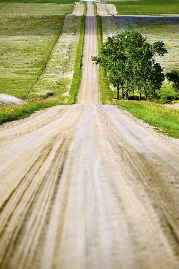 Country Road - Country Landscape. Kadoka near Rapid City South Dakota, USA. Vertical Photography. Country Road - Country Landscape. Kadoka near Rapid City South Dakota, USA. Vertical Photography.