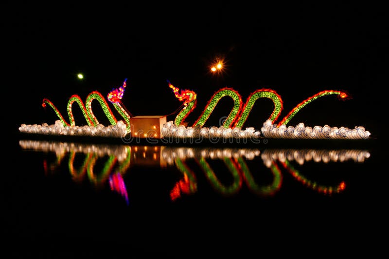 Lantern in serpent design reflection royalty free stock photography