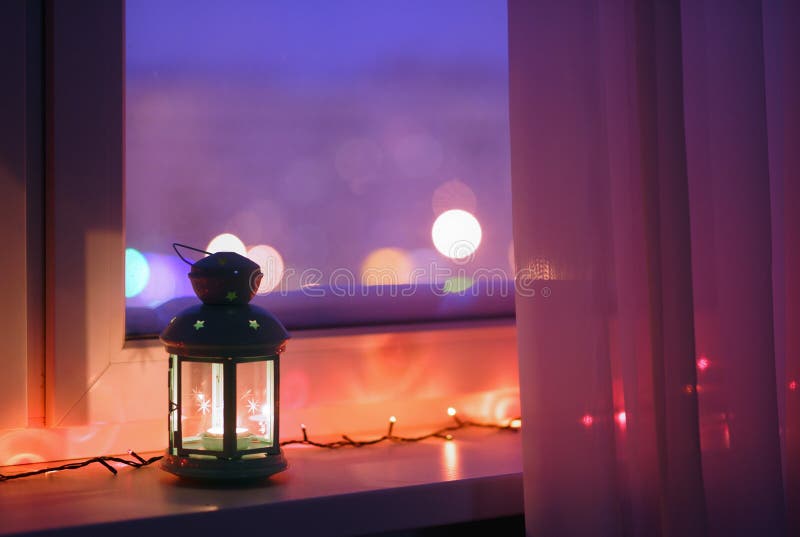 Lantern on a window sill stock photo. Image of holiday 65917898