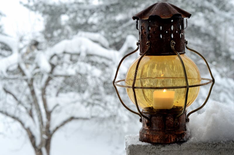 Vintage xmas lantern against the winter garden. Vintage xmas lantern against the winter garden