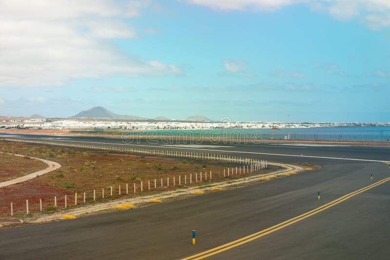 Lanzarote airport runaway with view on the city royalty free stock photography Lanzarote airport runaway with view on the city royalty free stock photography