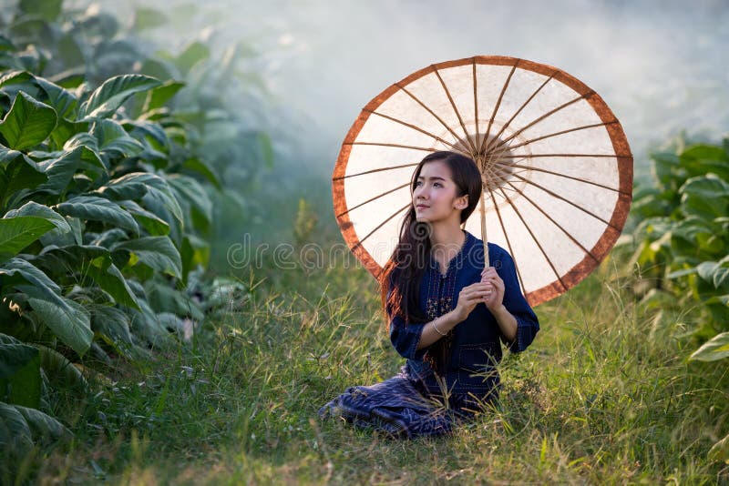 Lao woman holding umbrella