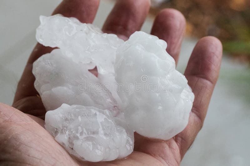 Hail stones held in hand after thunder storm. Hail stones held in hand after thunder storm