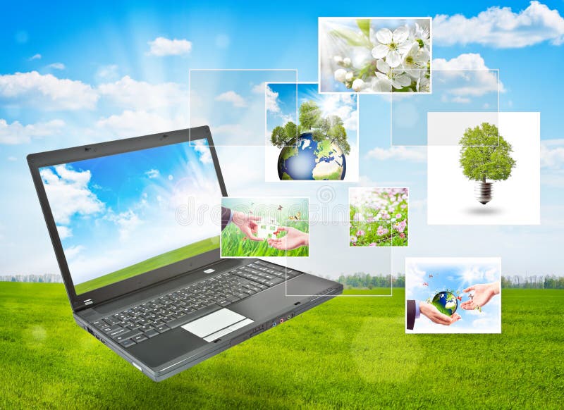 Laptop against green nature background