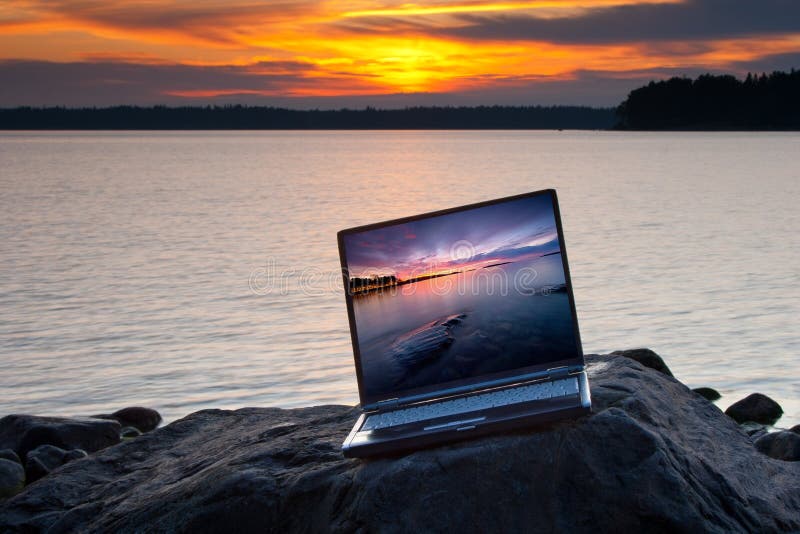 Laptop on the beach rock