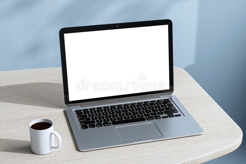 Laptop with blank white screen and coffee cup on light wooden desk in modern office interior with blue wall background for stock illustration