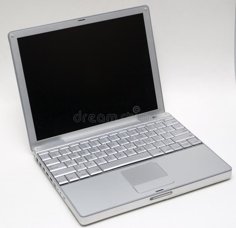 Plata computadora portátil sobre el blanco.