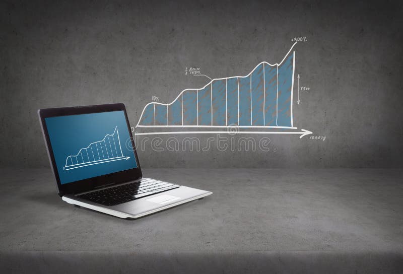 Laptop computer with graph on screen royalty free stock images