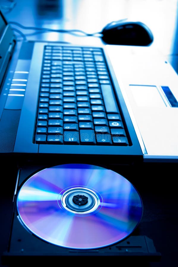 Laptop computer with opened cd-tray stock image