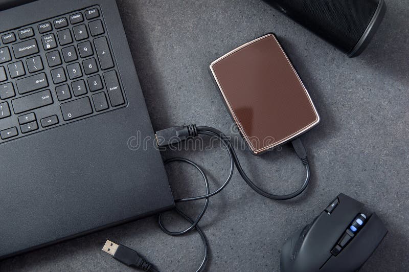 Laptop with Connected Portable Hard Drive. Stock Photo Image of