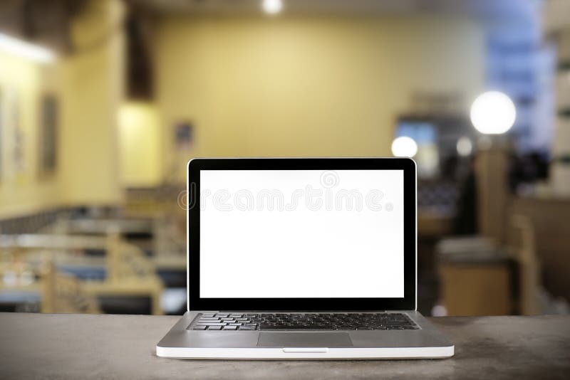 Laptop on counter bar in cafe.