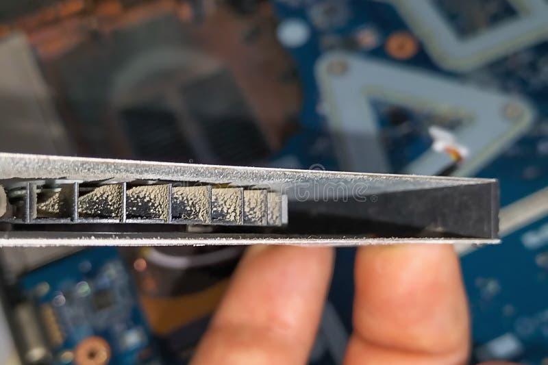 Laptop CPU cooling fan with clogged guide vanes. In the process of work, clogged with dust, leads to noise, overheating stock photo
