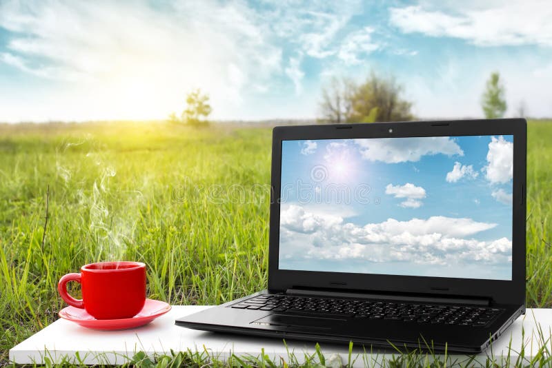 Laptop and cup of hot coffee on the table, outdoor office. Traveling by airplane. Travel concept. Business ideas. stock photos Laptop and cup of hot coffee on the table, outdoor office. Traveling by airplane. Travel concept. Business ideas. stock photos
