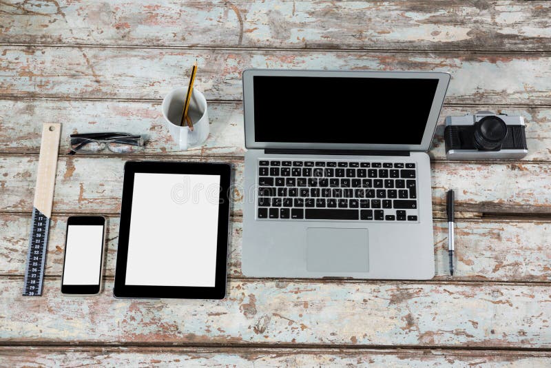 Laptop, Digital Tablet, Smartphone and Camera with Office Accessories
