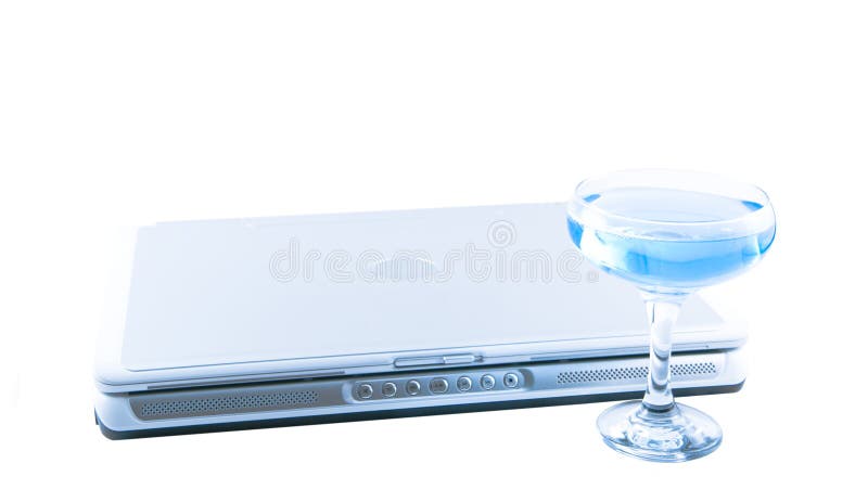 Laptop and a glass with a blue