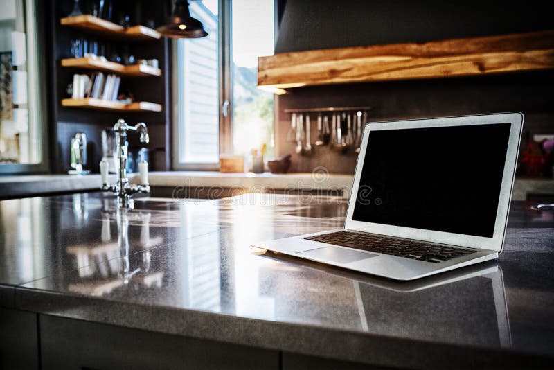 Laptop on kitchen counter stock image. Image of focus 142593155