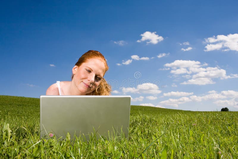 With Laptop on meadow