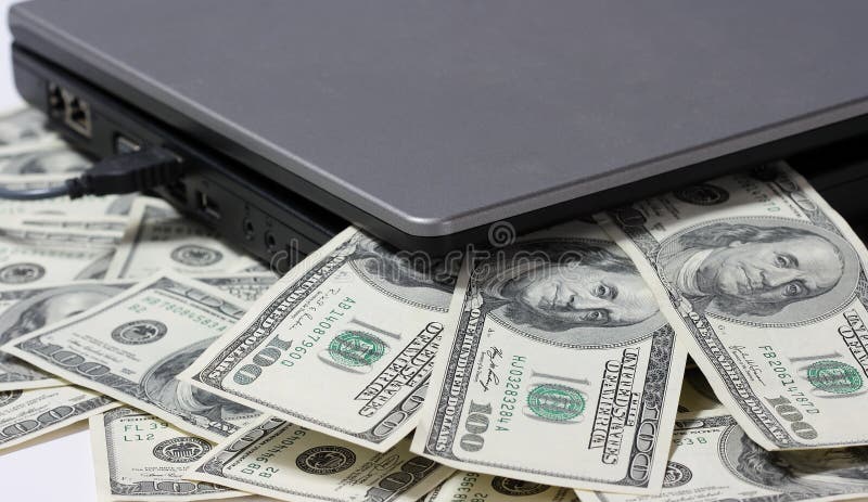Laptop and money. royalty free stock photography