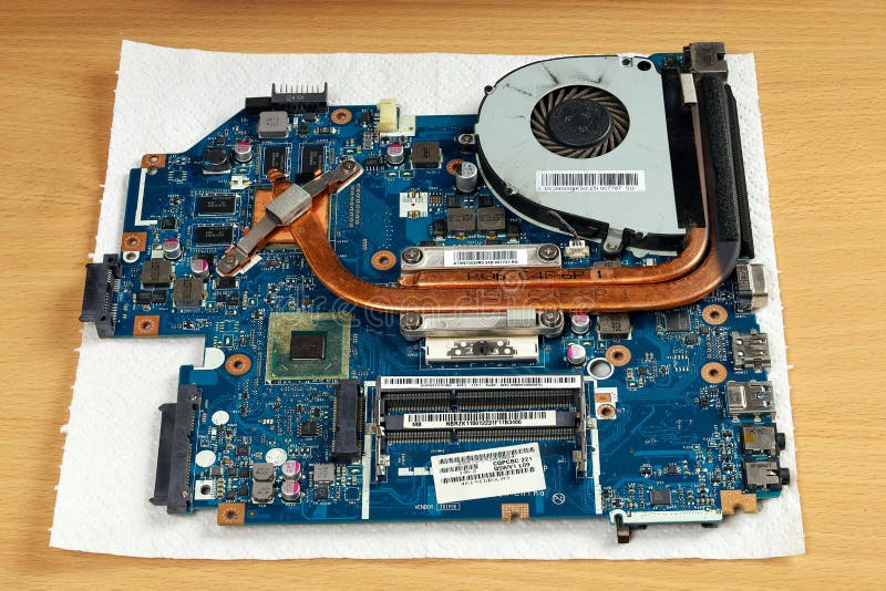 Laptop Repair, Motherboard with Processor Cooling System on Table