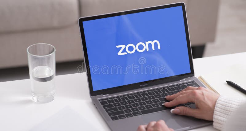 Laptop showing Zoom Cloud Meetings app logo. KHARKIV, UKRAINE - JULY 31, 2020: Laptop showing Zoom Cloud Meetings app logo for video conferences, live chat