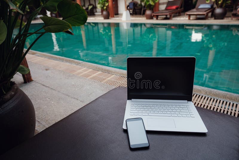 Laptop at the Swimming Pool and Smartphone Stock Image Image of