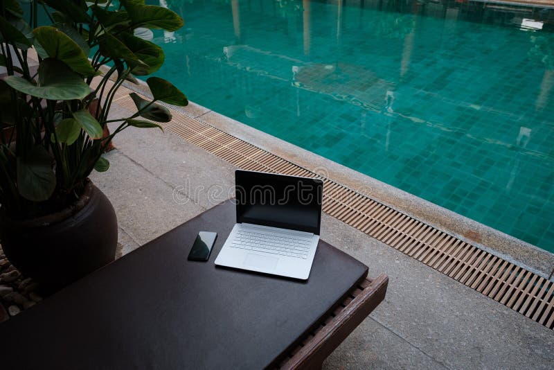 Laptop at the Swimming Pool and Smartphone Stock Photo Image of
